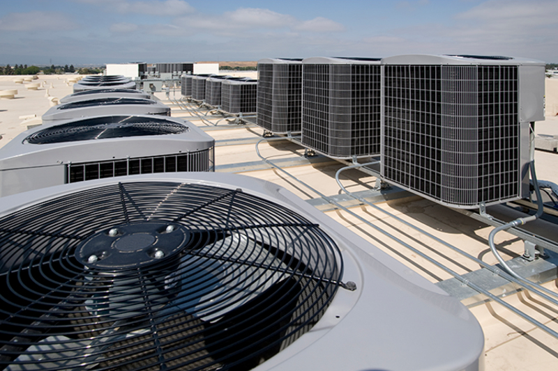 Why Is a Commercial AC Tune-Up Important? Air conditioning units on top of a building.